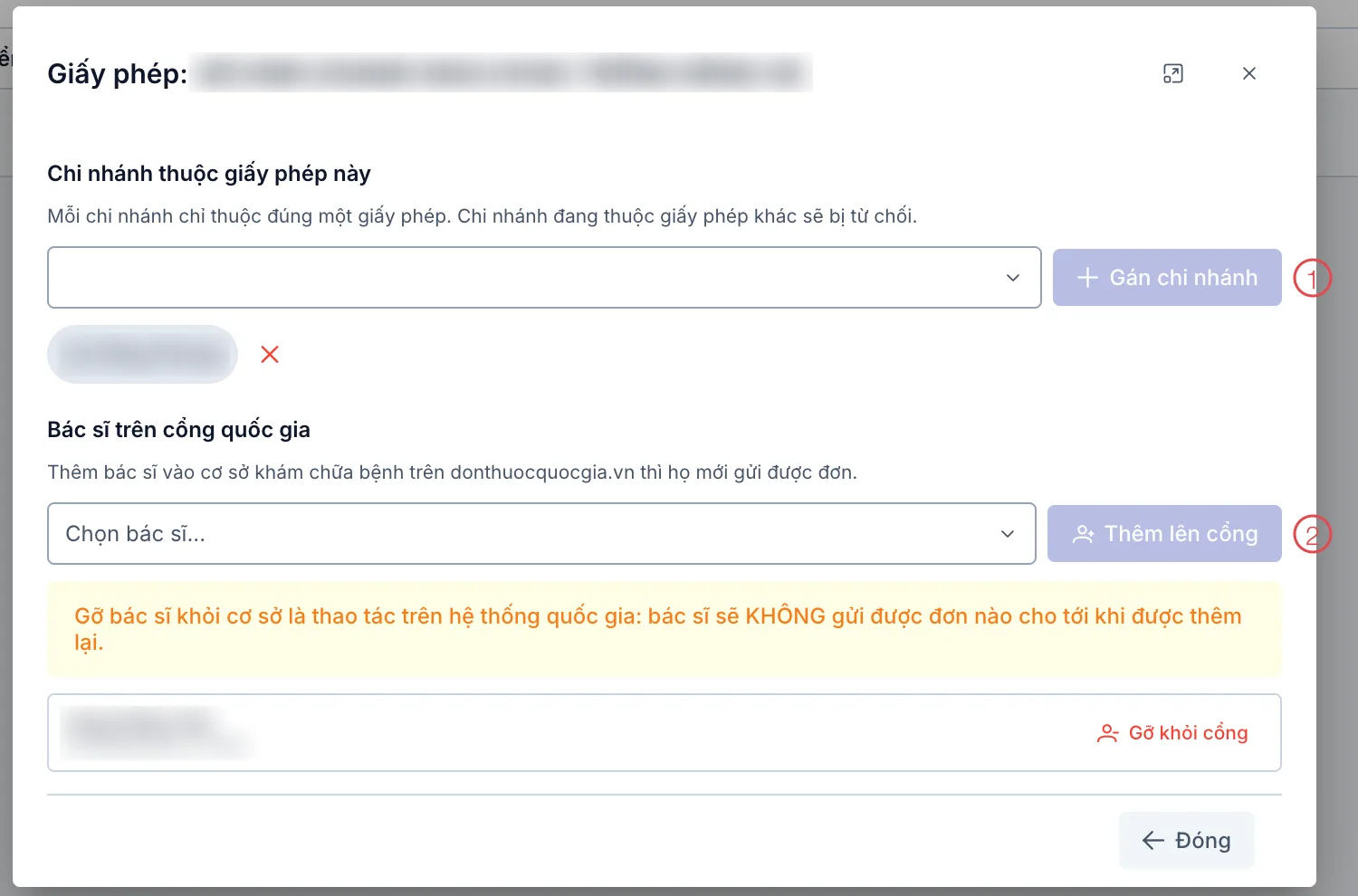 Hộp thoại Giấy phép với 2 nút được đánh số